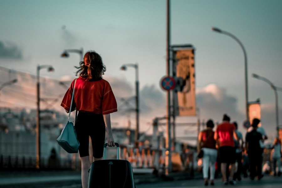 A woman walking with her suitcase on the way to the airport