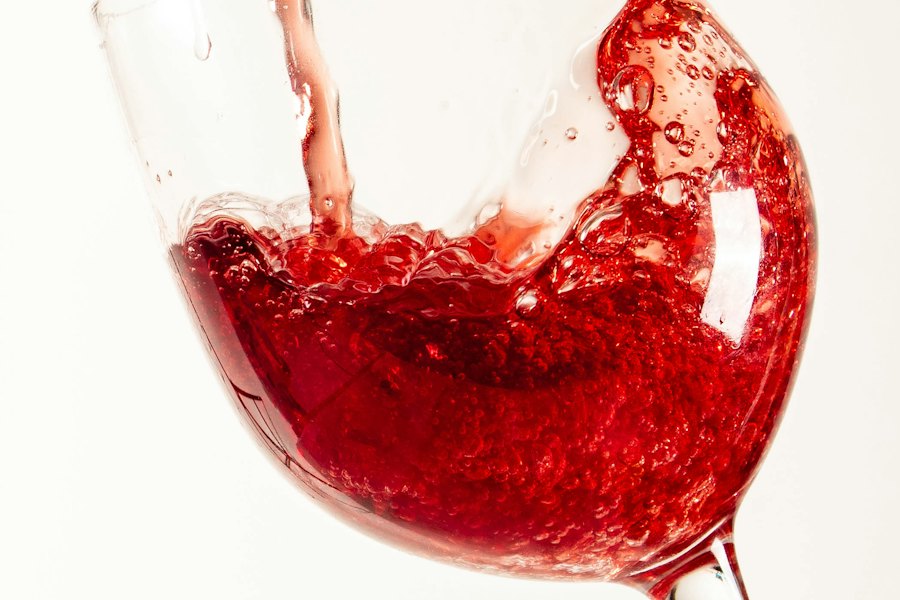 A filled glass of red wine