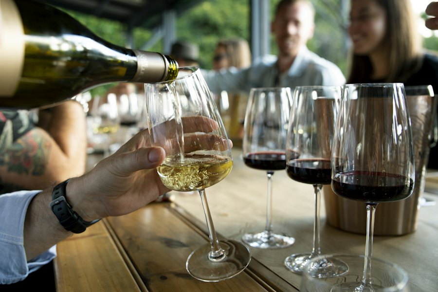 Friends around a table with wine poured
